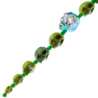 6.5 Inch Strand of Green Glass, Ceramic, and Howlite Skull Beads